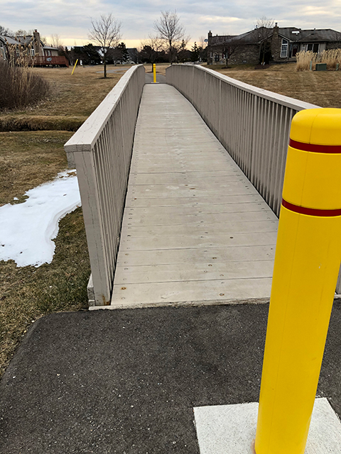 A walking trail bridge entrance